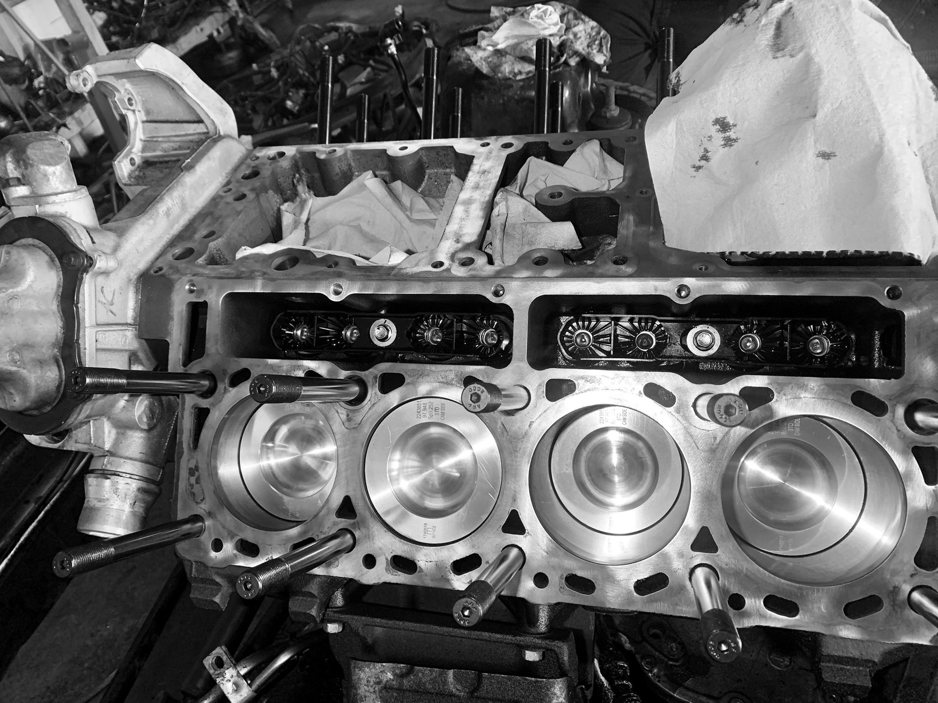 Engine block with cylinders, partially disassembled for repair.