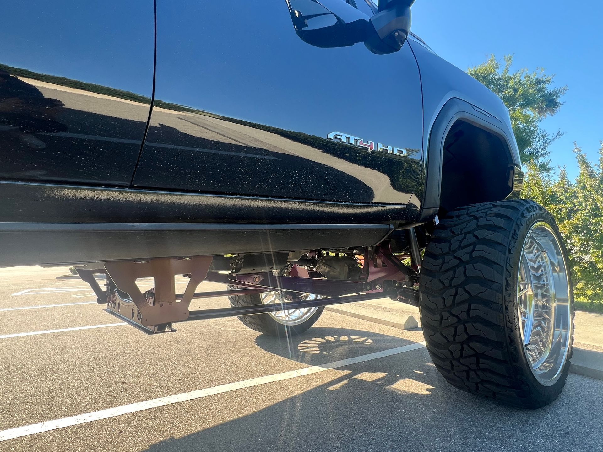A gmc truck is parked in a parking lot.