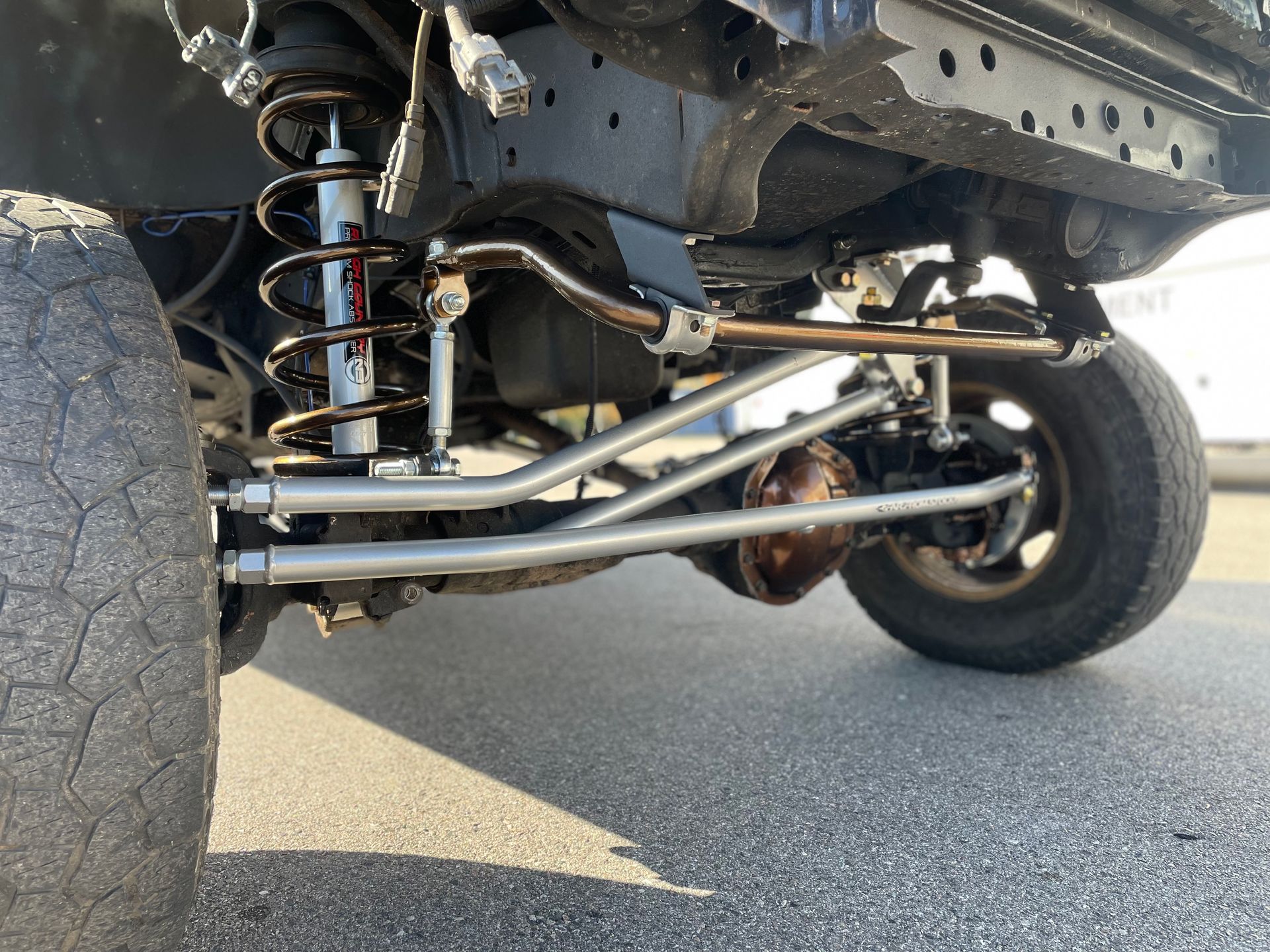 A close up of the suspension system of a truck.
