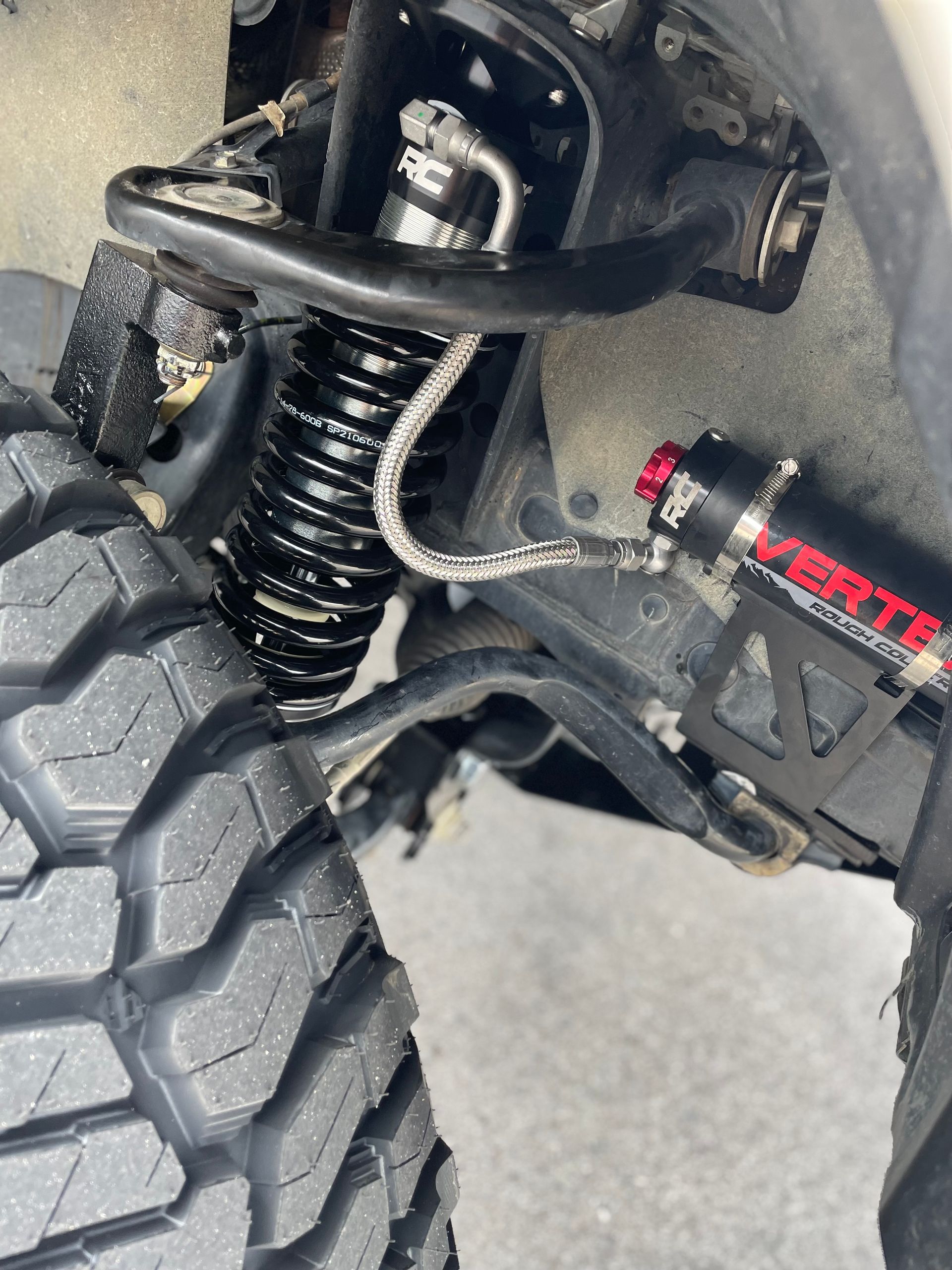A close up of a suspension system on a truck