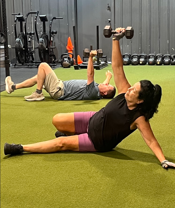 Women doing exercise on the gym floor