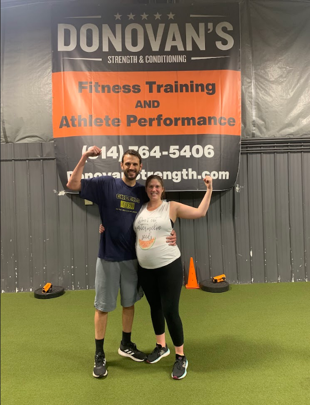 Couple posing at the gym