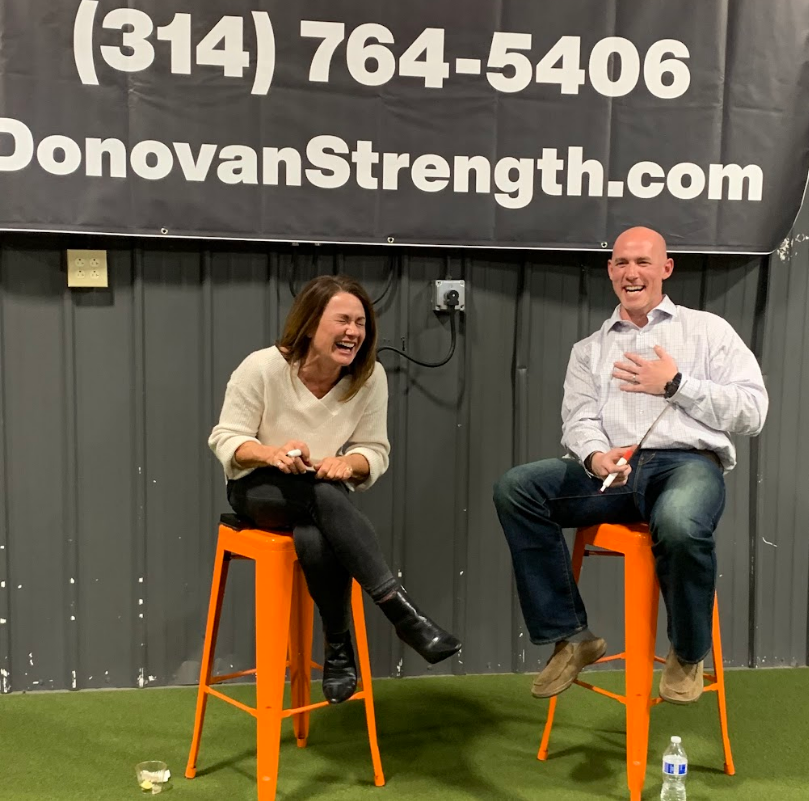 Two people are on the chair laughing