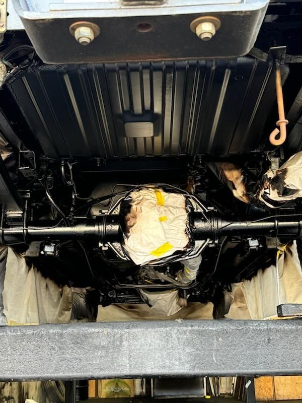 A close up of the underside of a car.