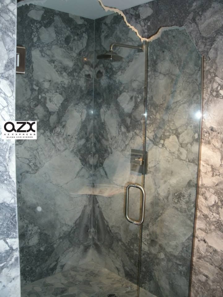 A bathroom with a walk in shower