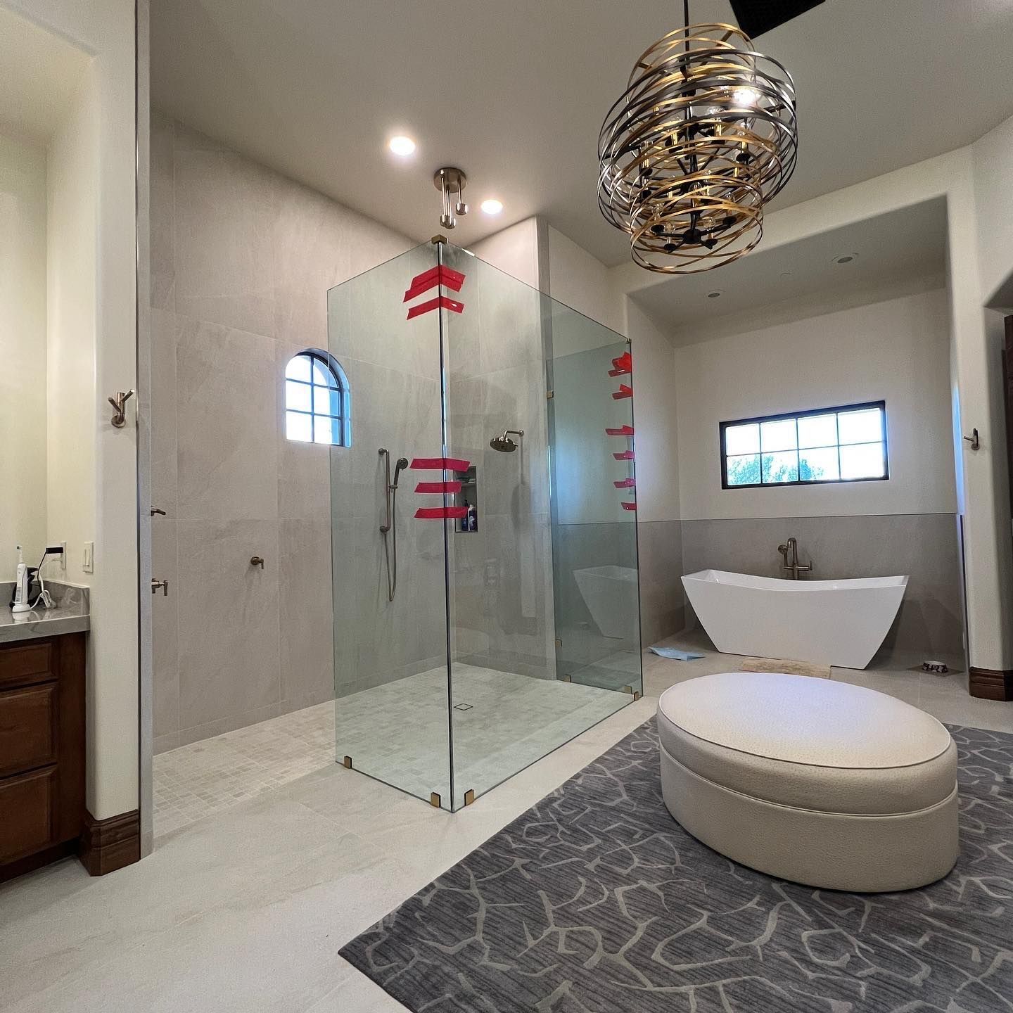 A bathroom with a walk in shower and a bathtub