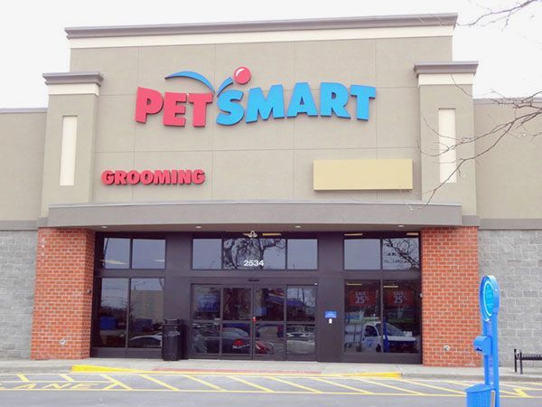 A petsmart store with a parking meter in front of it