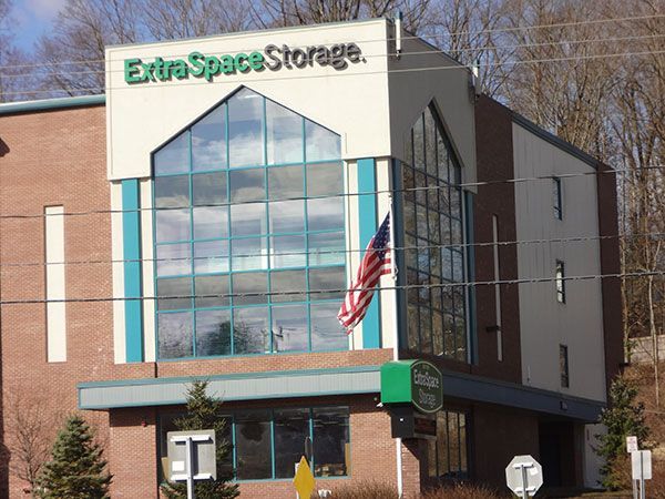 A large house with a swimming pool in front of it