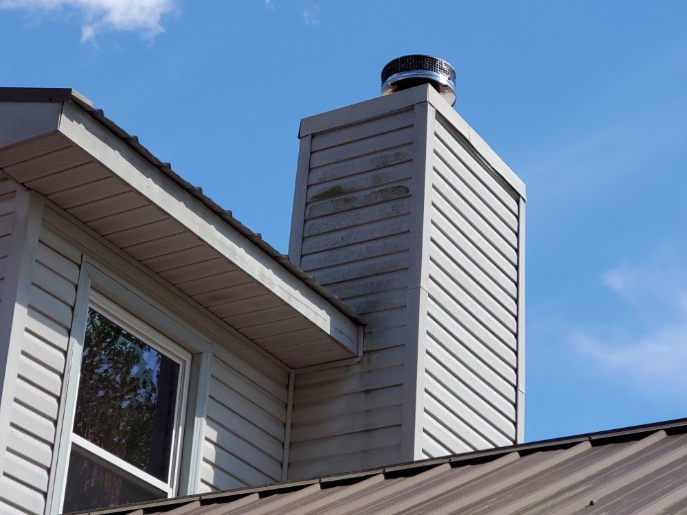 A house with a chimney on top of it