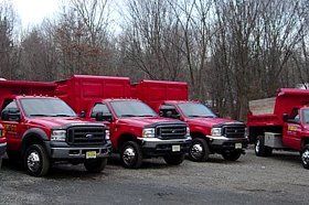 Red snowplow trucks