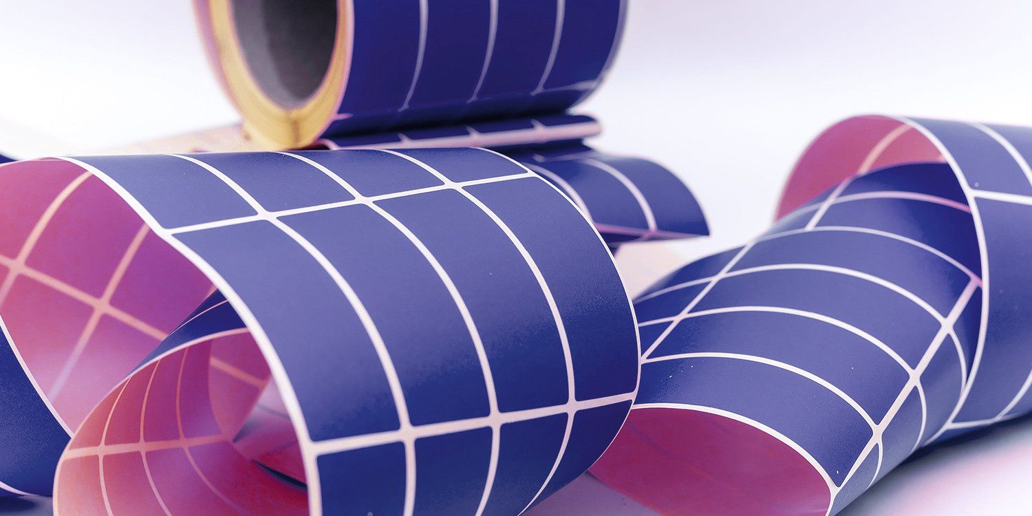 A bunch of rolls of solar panels are stacked on top of each other