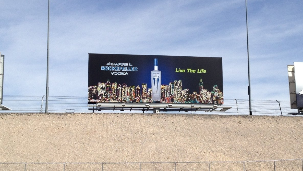 A billboard with a bottle of vodka on it