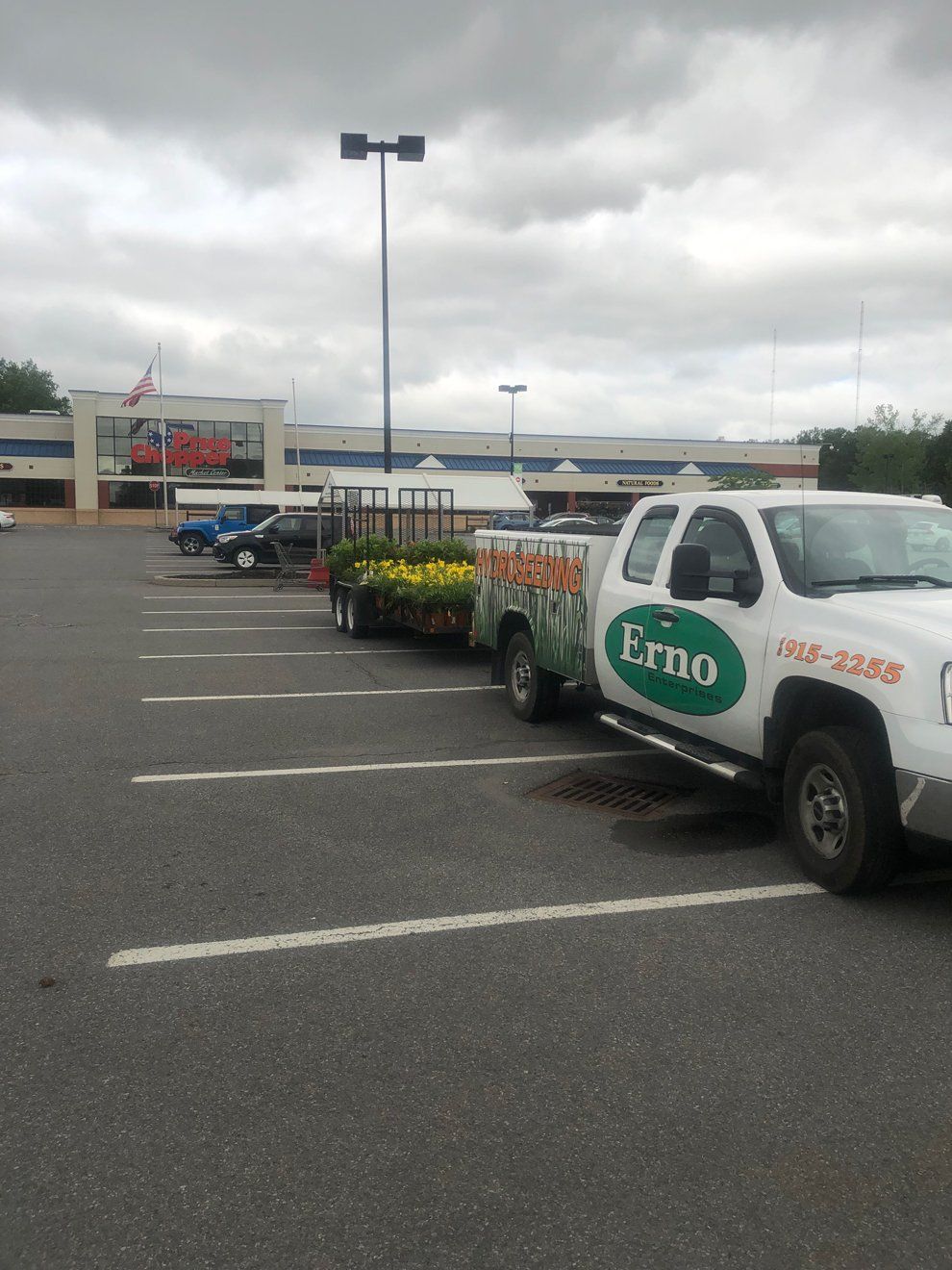 Erno Enterprises truck and trailer in commercial landscaping area