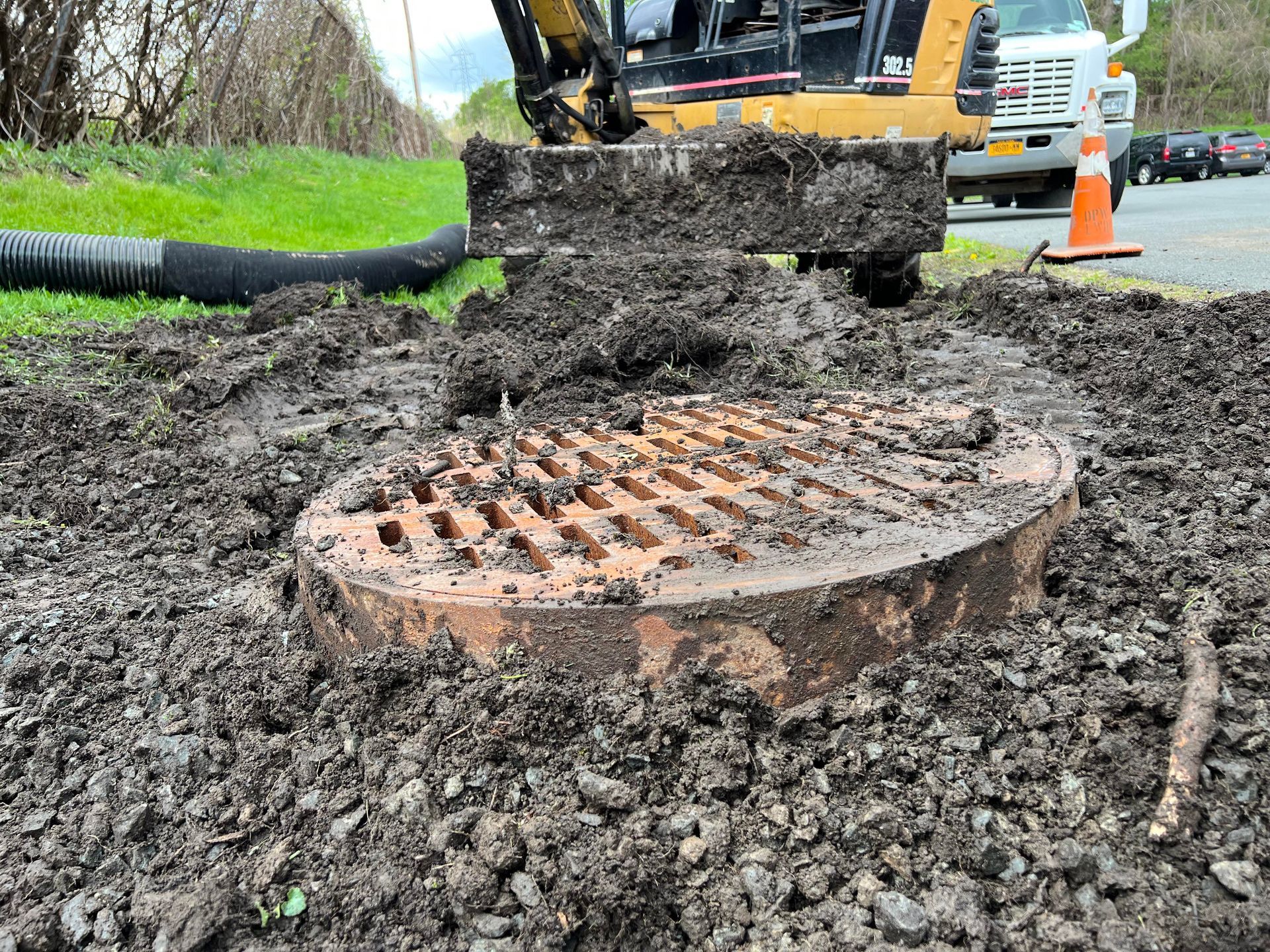 a manhole cover in front of a bulldozer .