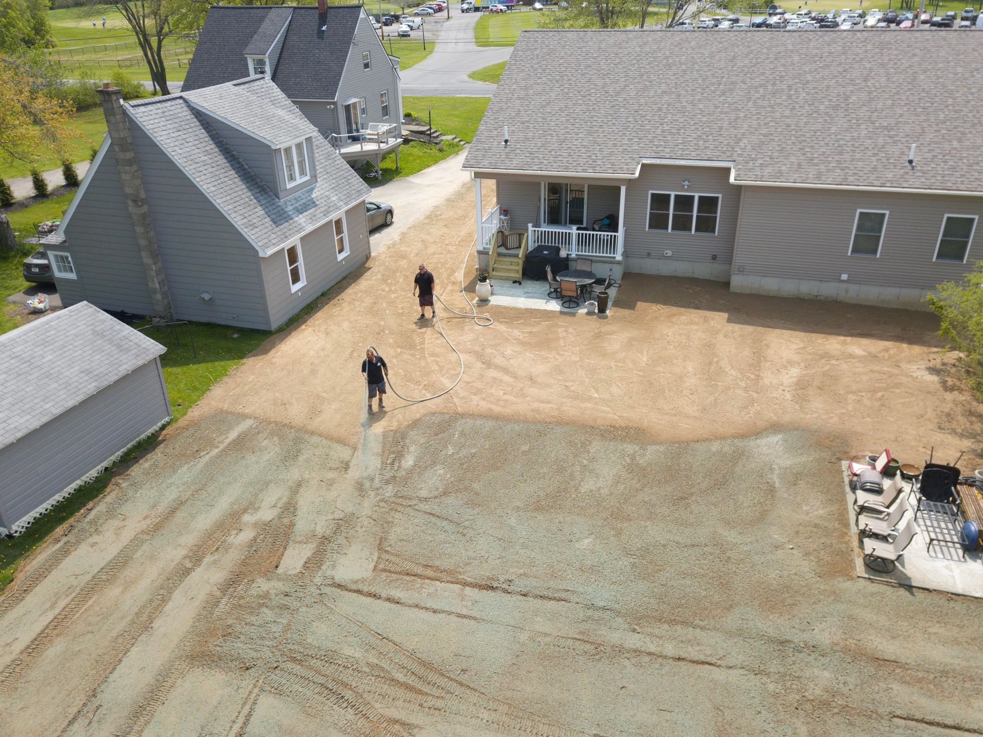 an aerial view of a house with a hydroseeded lot .