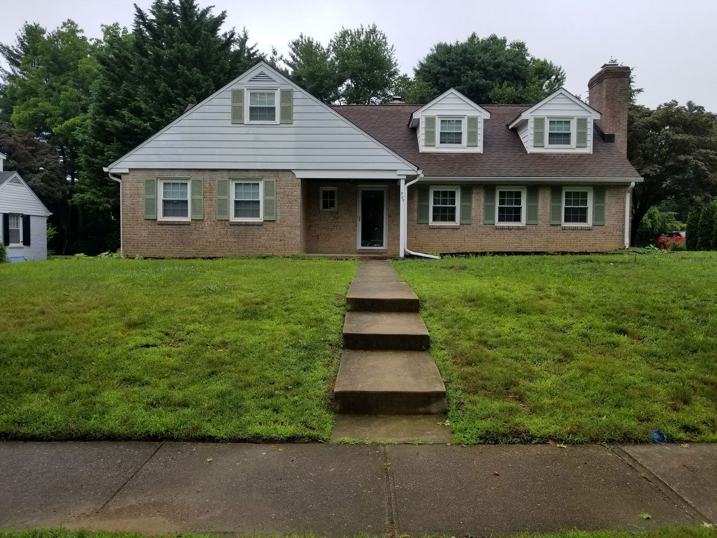 A brick house with steps leading up to it