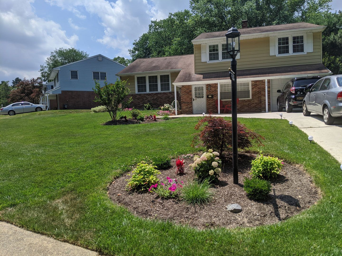 A house with a lot of flowers in front of it