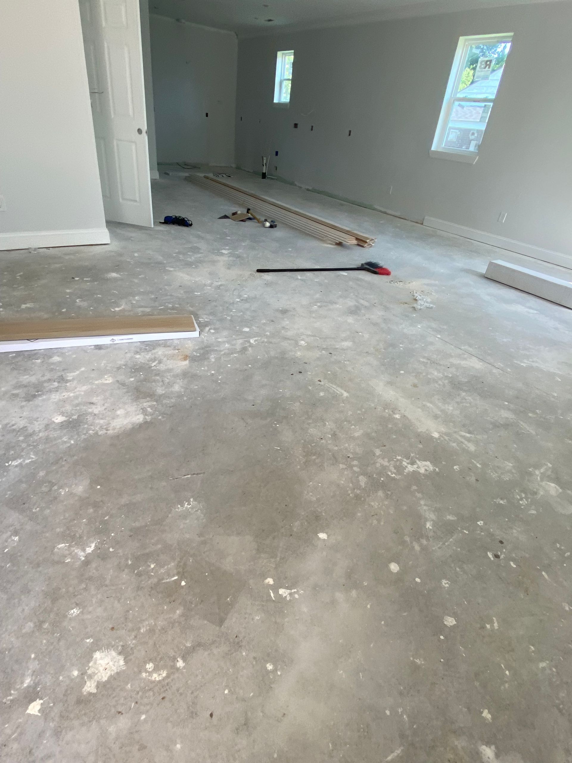 A bed frame with drawers underneath it is sitting on a carpeted floor in a bedroom.