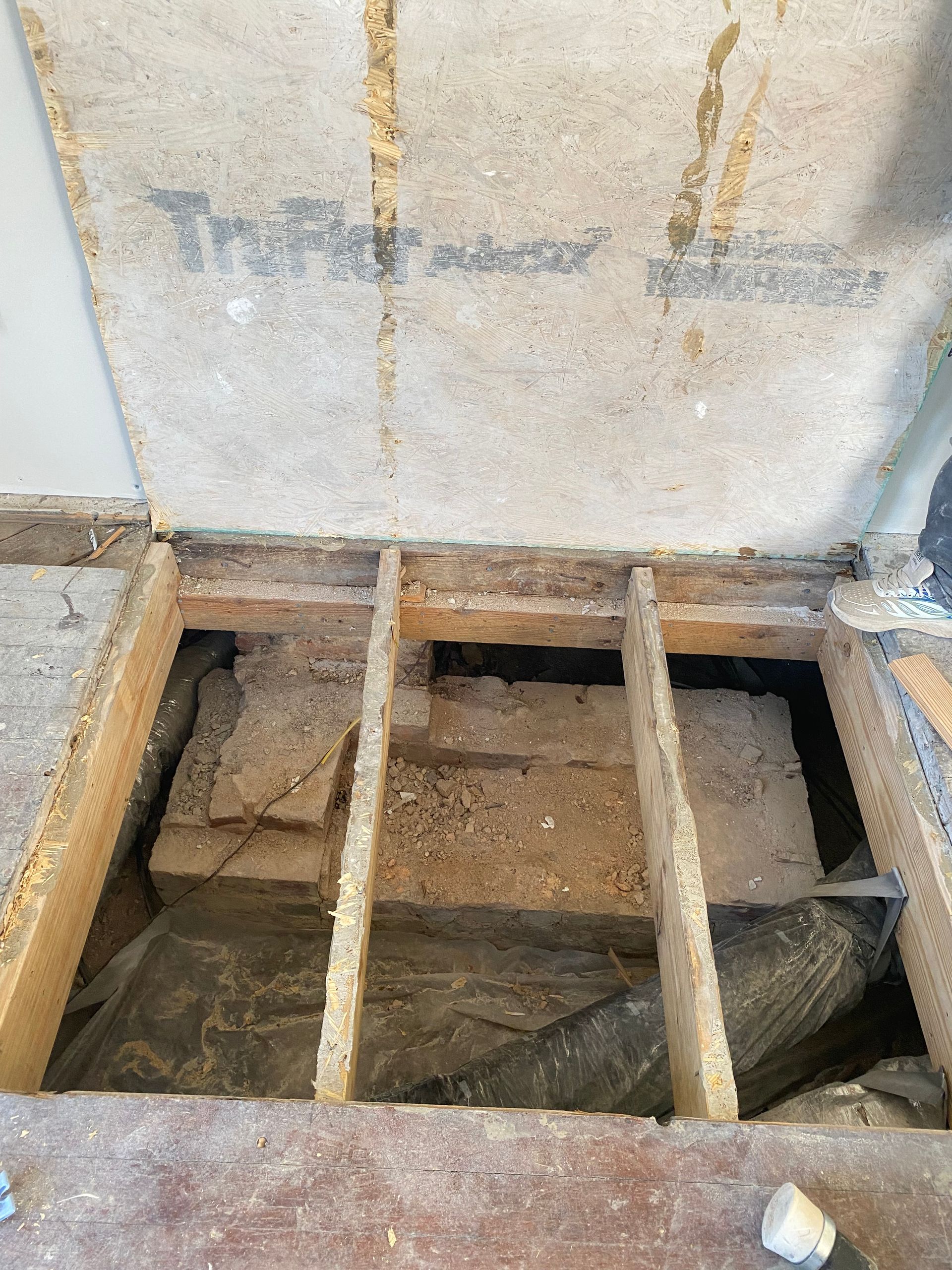 There is a hole in the floor of a building.