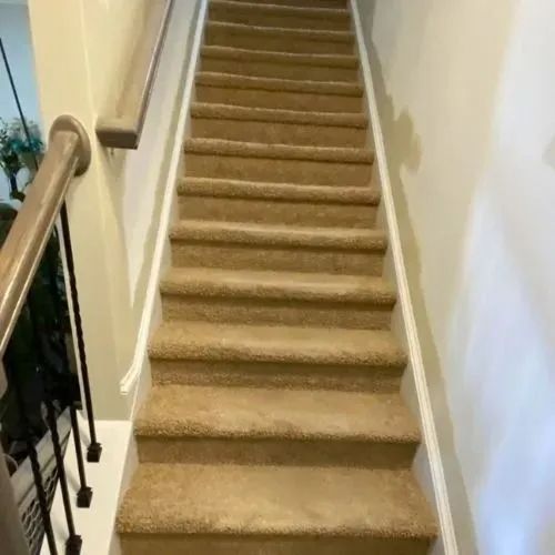 A set of stairs leading up to the second floor of a house.