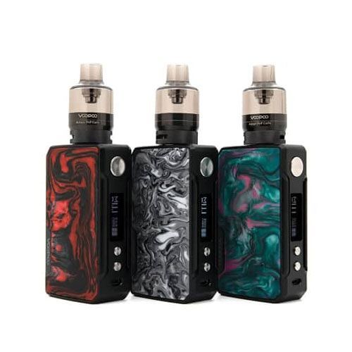 A group of three e cigarettes are sitting next to each other on a table.