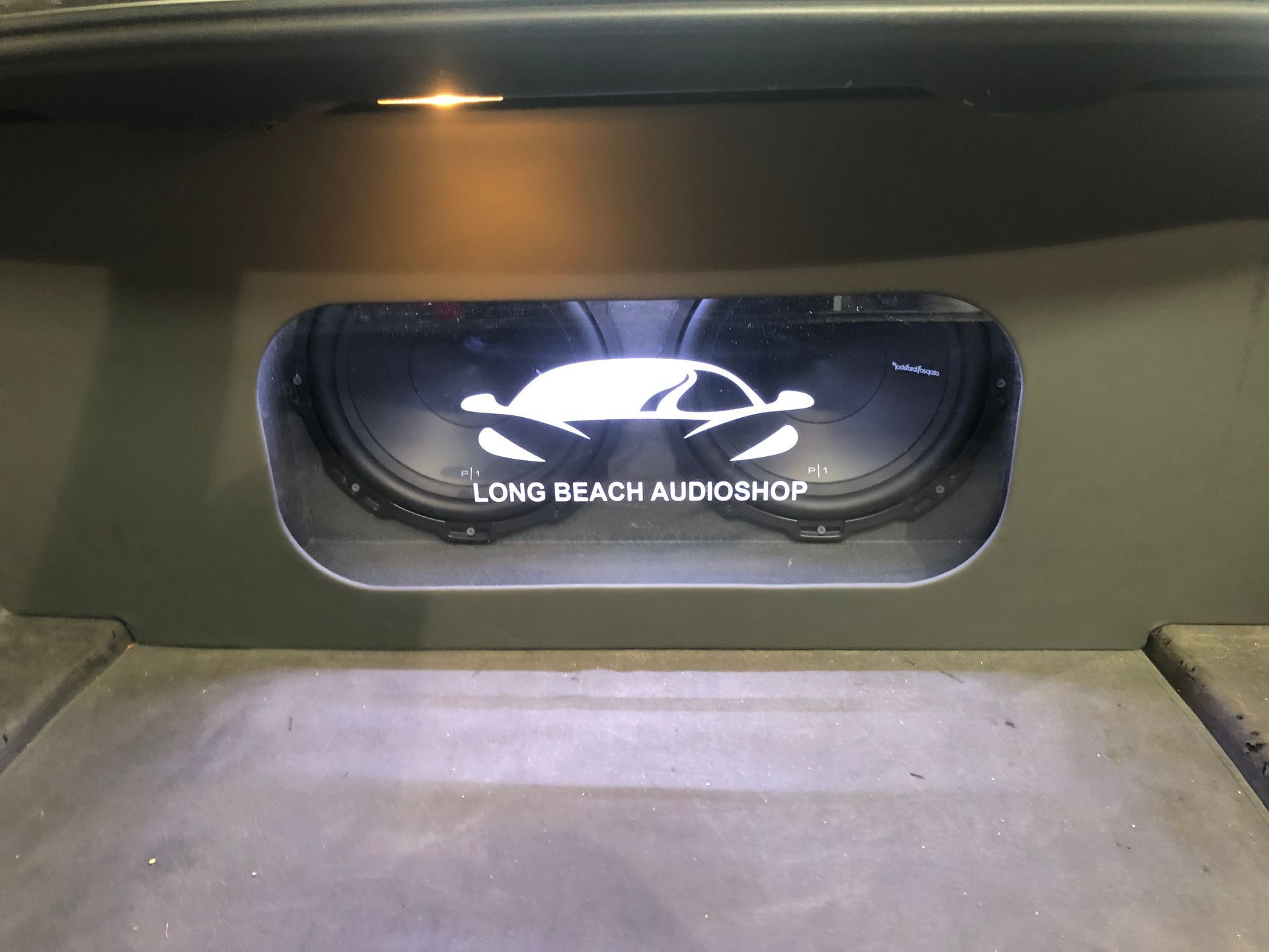 A car with a subwoofer in the back of it.