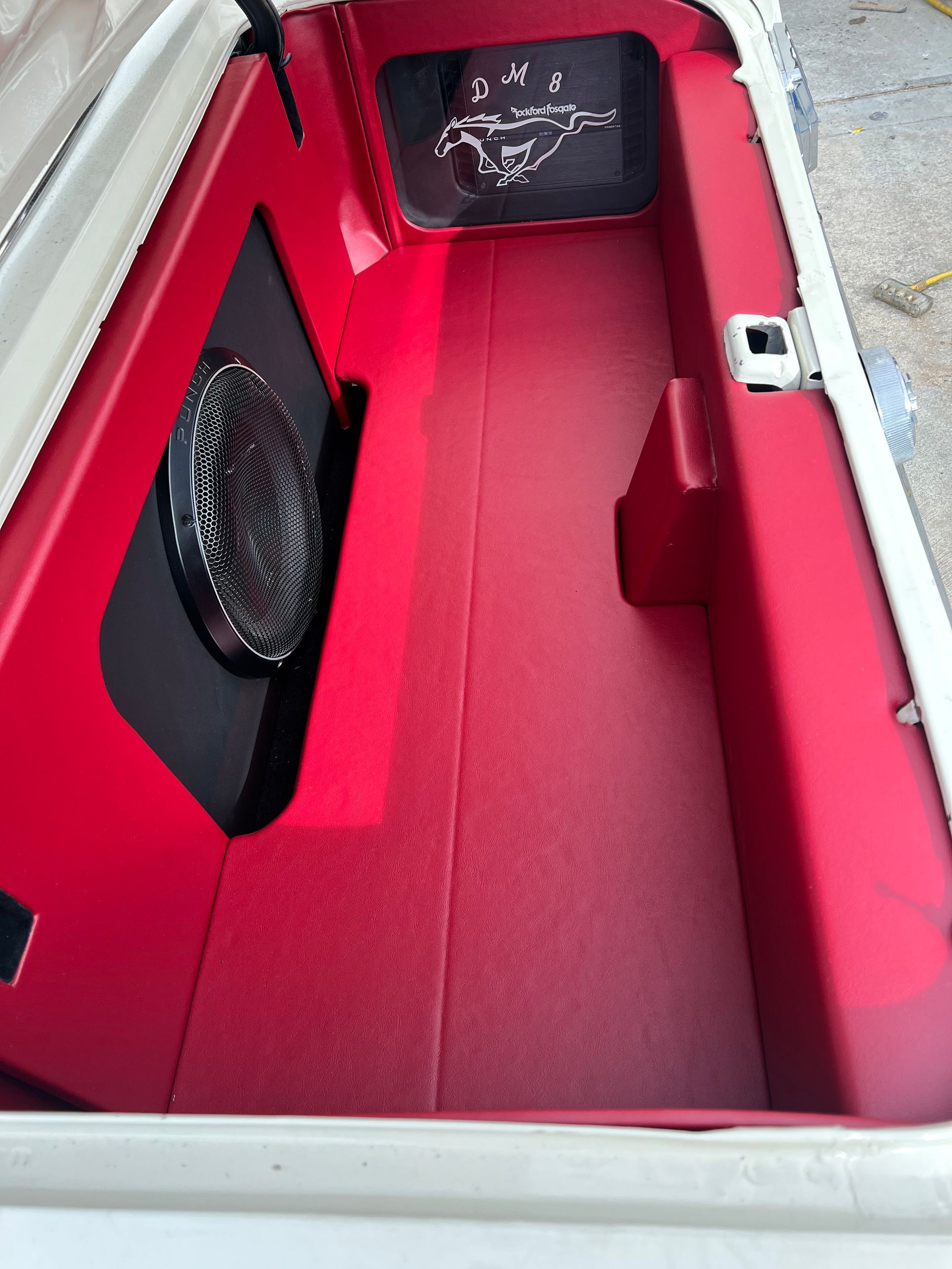 The trunk of a boat has a speaker in it