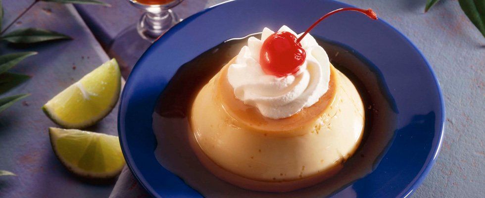 flan topped with whipped cream