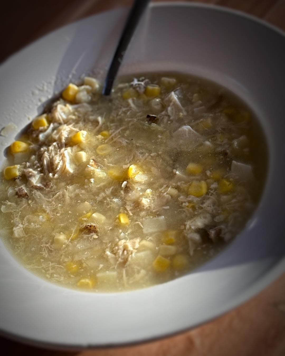 A bowl of soup with a spoon in it