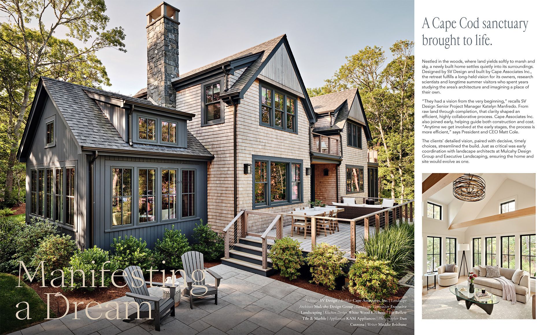 Cottage-style gray house with white trim, stone chimney, and a small patio garden beside a design magazine page