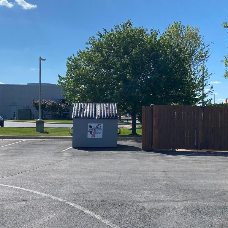 a dumpster in a parking lot