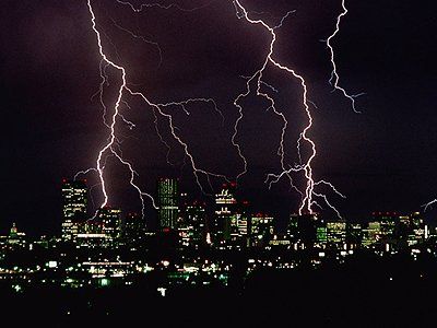 Lightning over city buildings