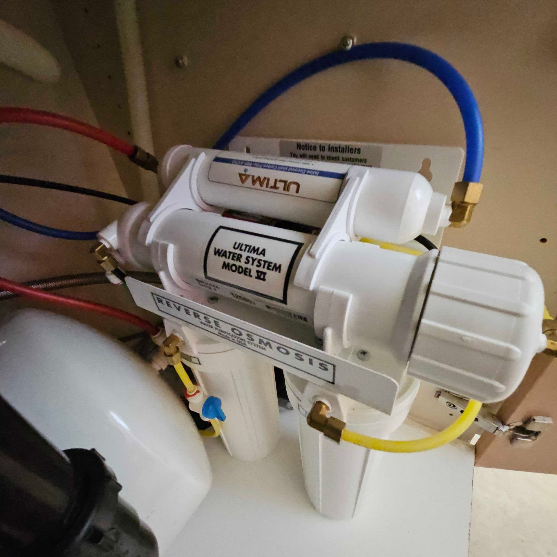 A water filter with ultima written on it