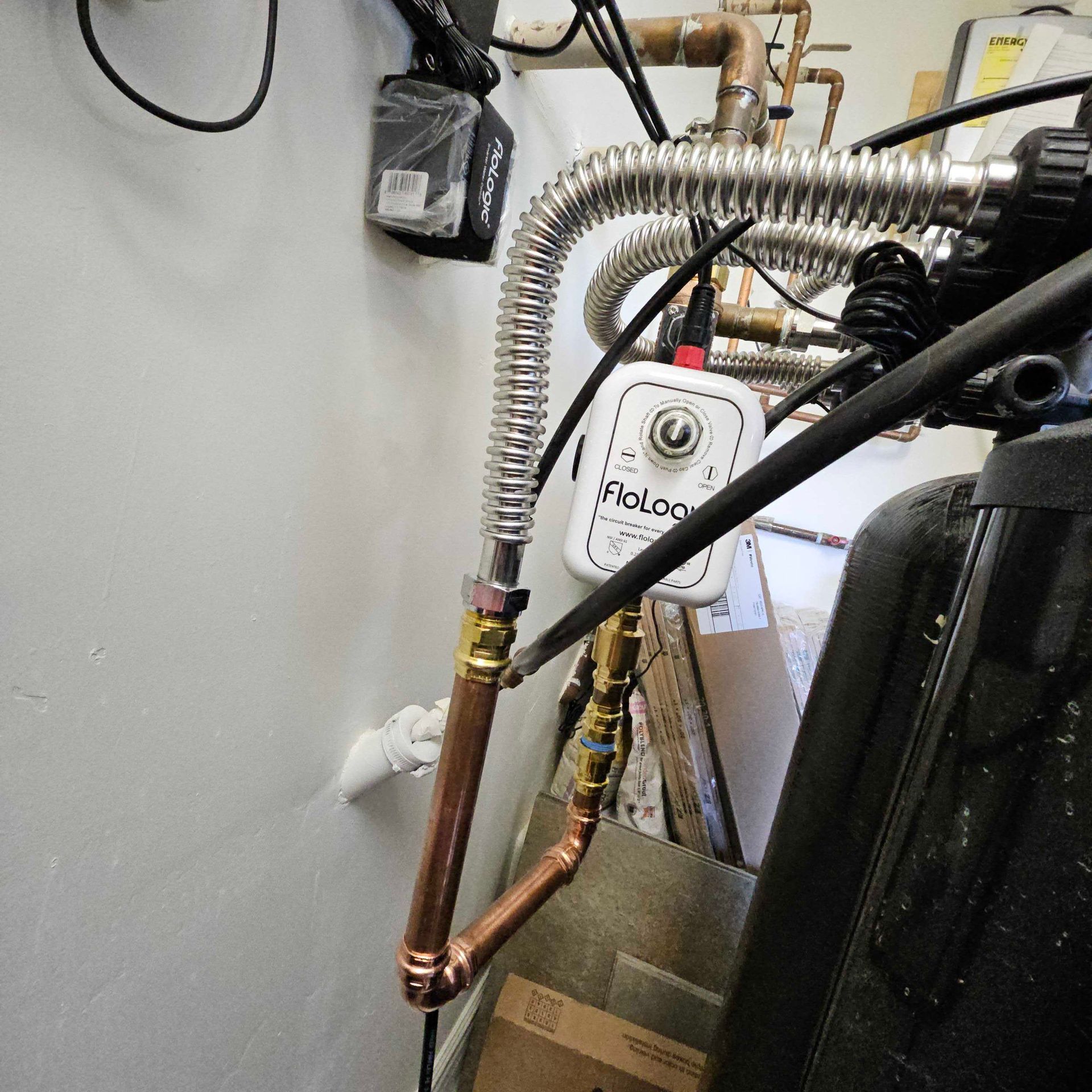 A copper pipe is attached to a stainless steel pipe