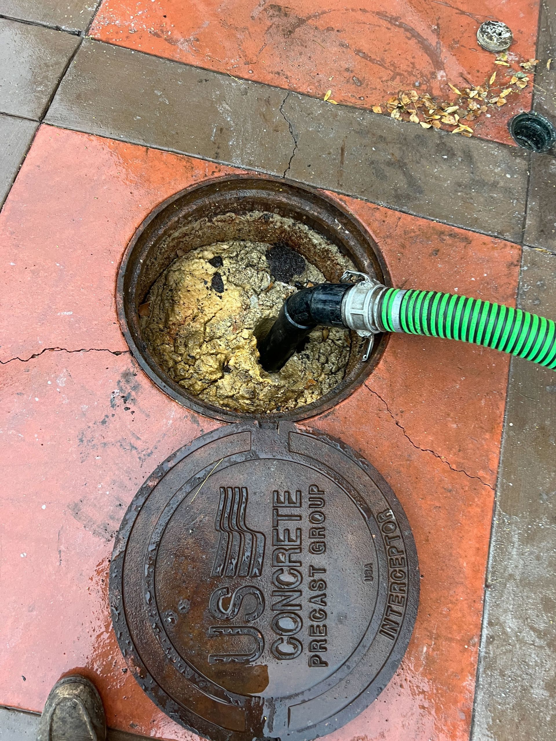 A manhole cover with the word concrete on it