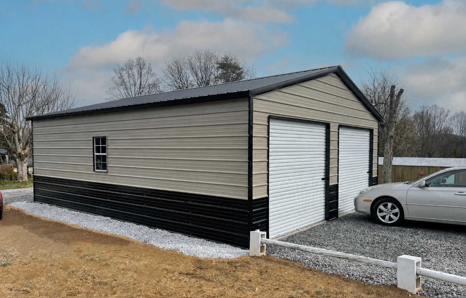 Tan metal storage building with white garage doors, black trim, and a car parked beside it.