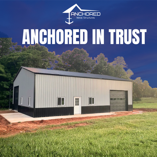 Anchored steel building with garage door in grassy lot under blue sky, labeled “Anchored in Trust”