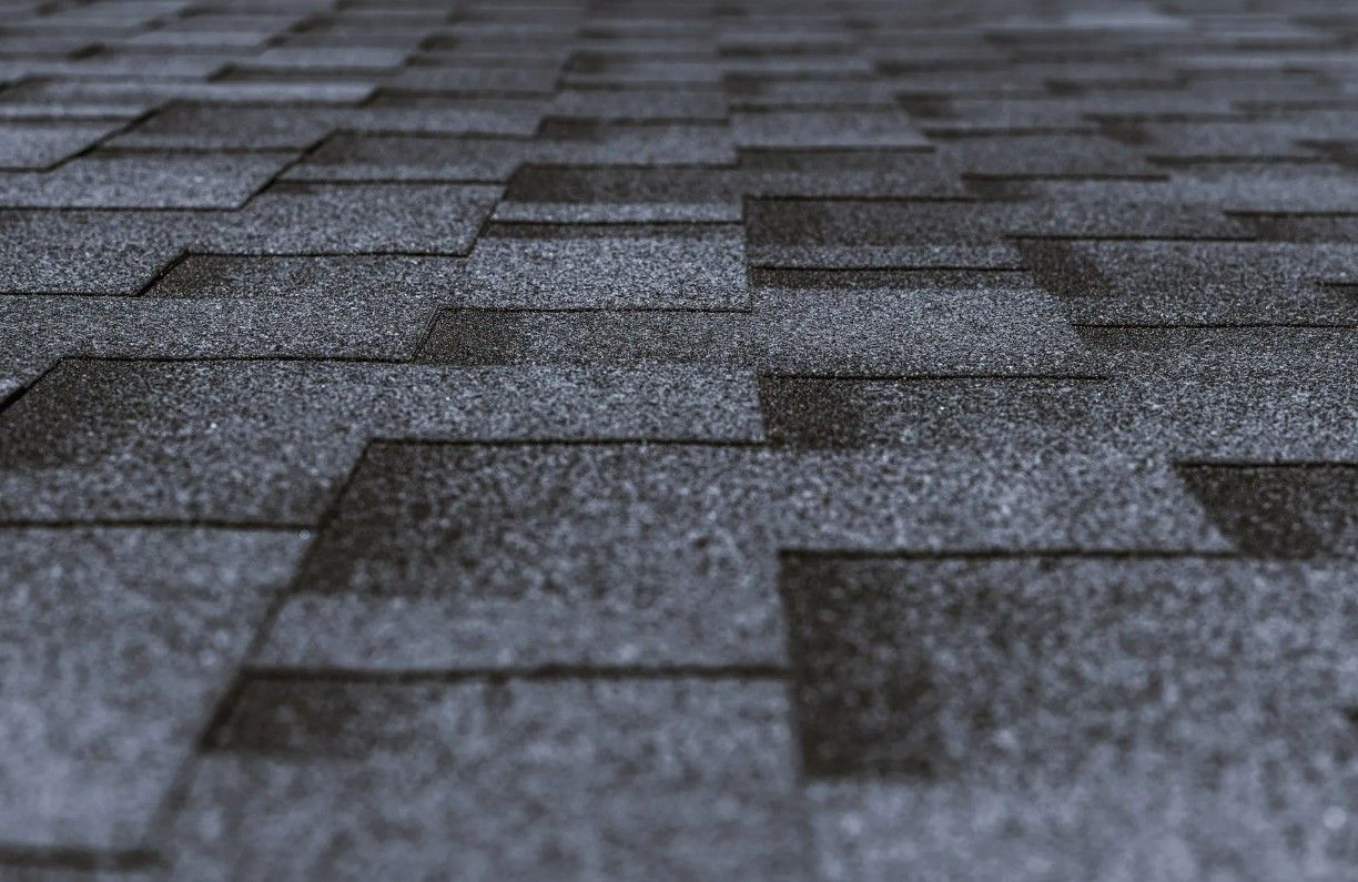 A close up of a roof with shingles on it