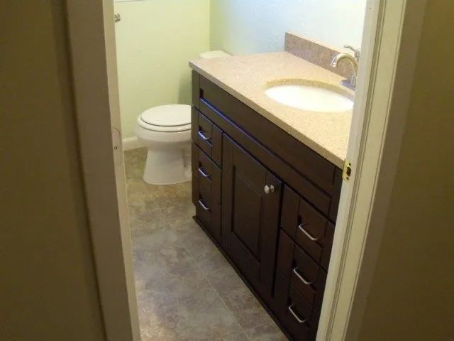 A bathroom with a sink and toilet in it