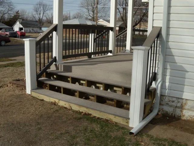 A white house with stairs leading up to it