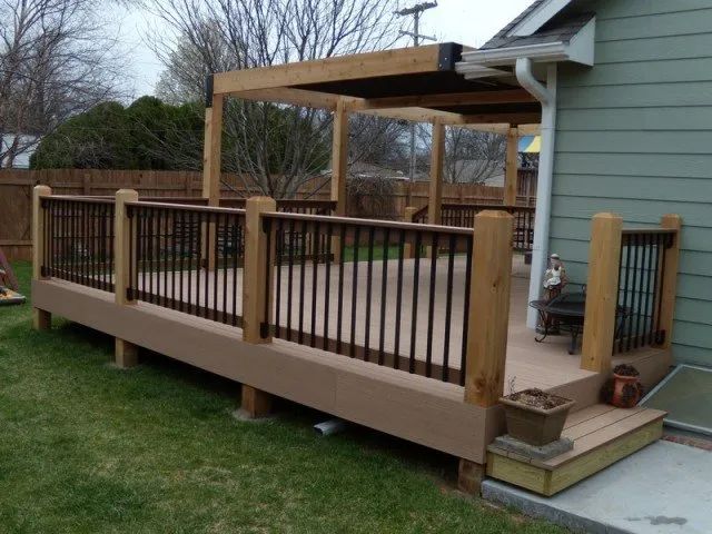 A deck with a pergola on top of it