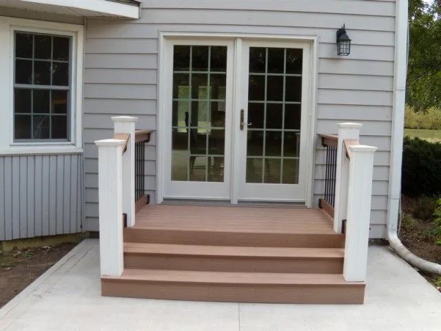 A house with a patio and sliding glass doors
