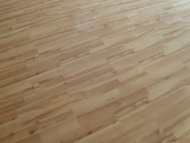 A close up of a wooden floor in a room