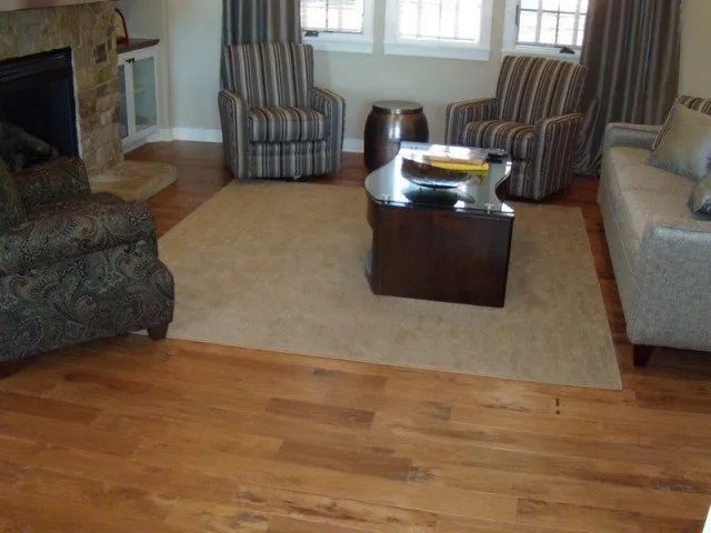 A living room filled with furniture and a fireplace