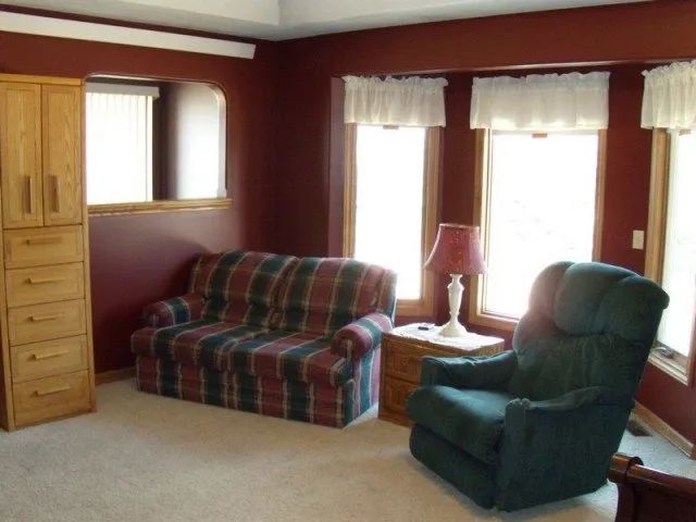 A living room with a couch and a chair