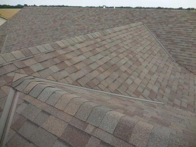 A close up of a roof with shingles on it