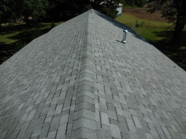 A close up of a roof with shingles on it