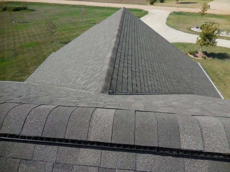 The roof of a house is shaped like a pyramid