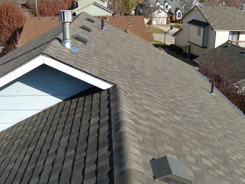 The roof of a house with a chimney on it
