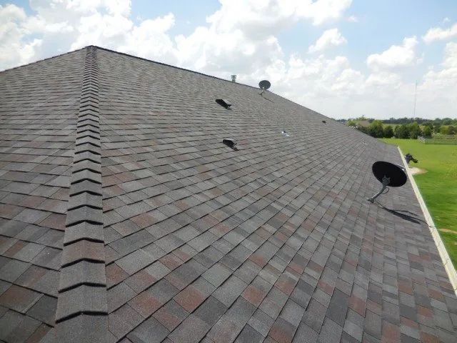 A roof with a satellite dish on it
